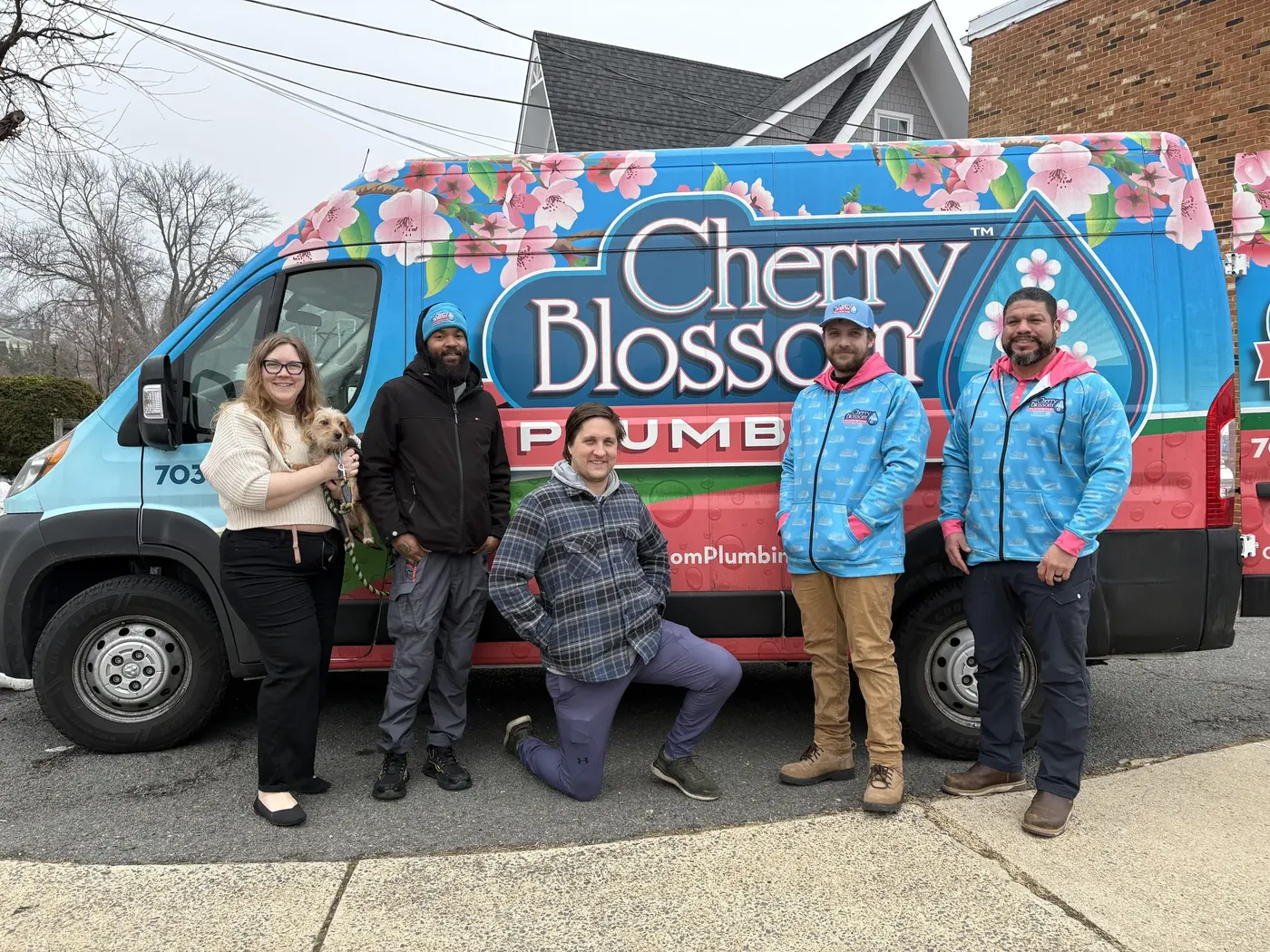 Cherry Blossom Plumbing team standing together, February 2026