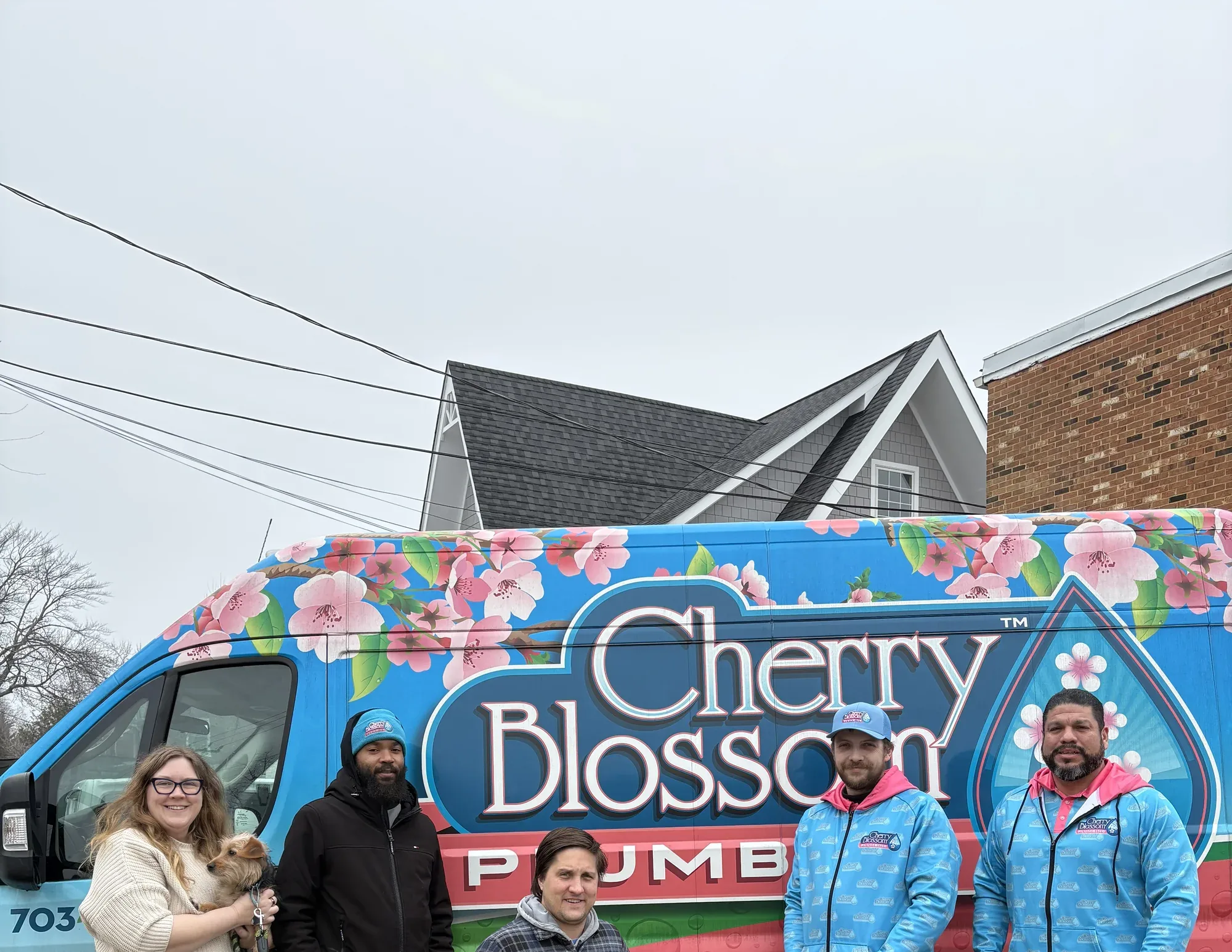 Full Cherry Blossom Plumbing crew with branded van