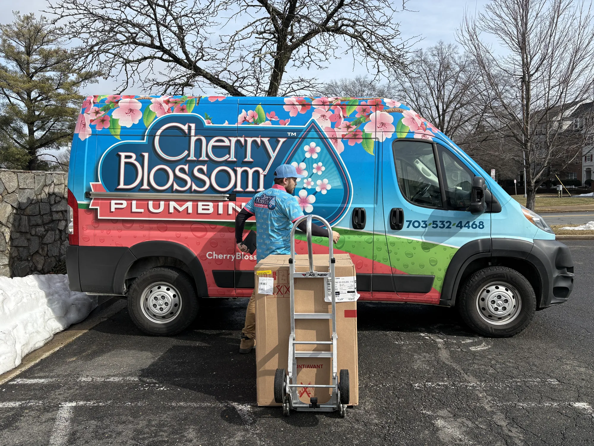 Tech in Front of Van with New Water Heater