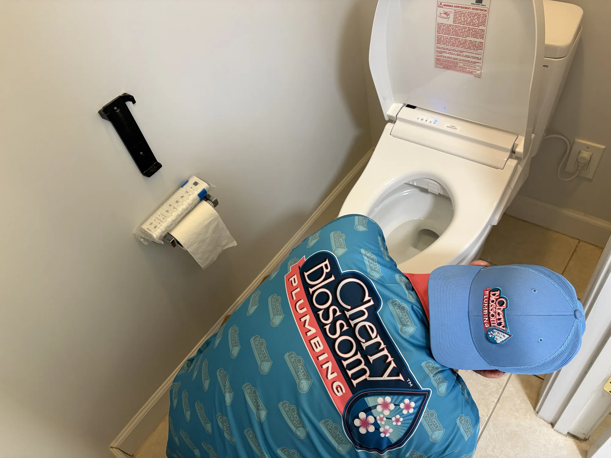 Technician installing a smart toilet