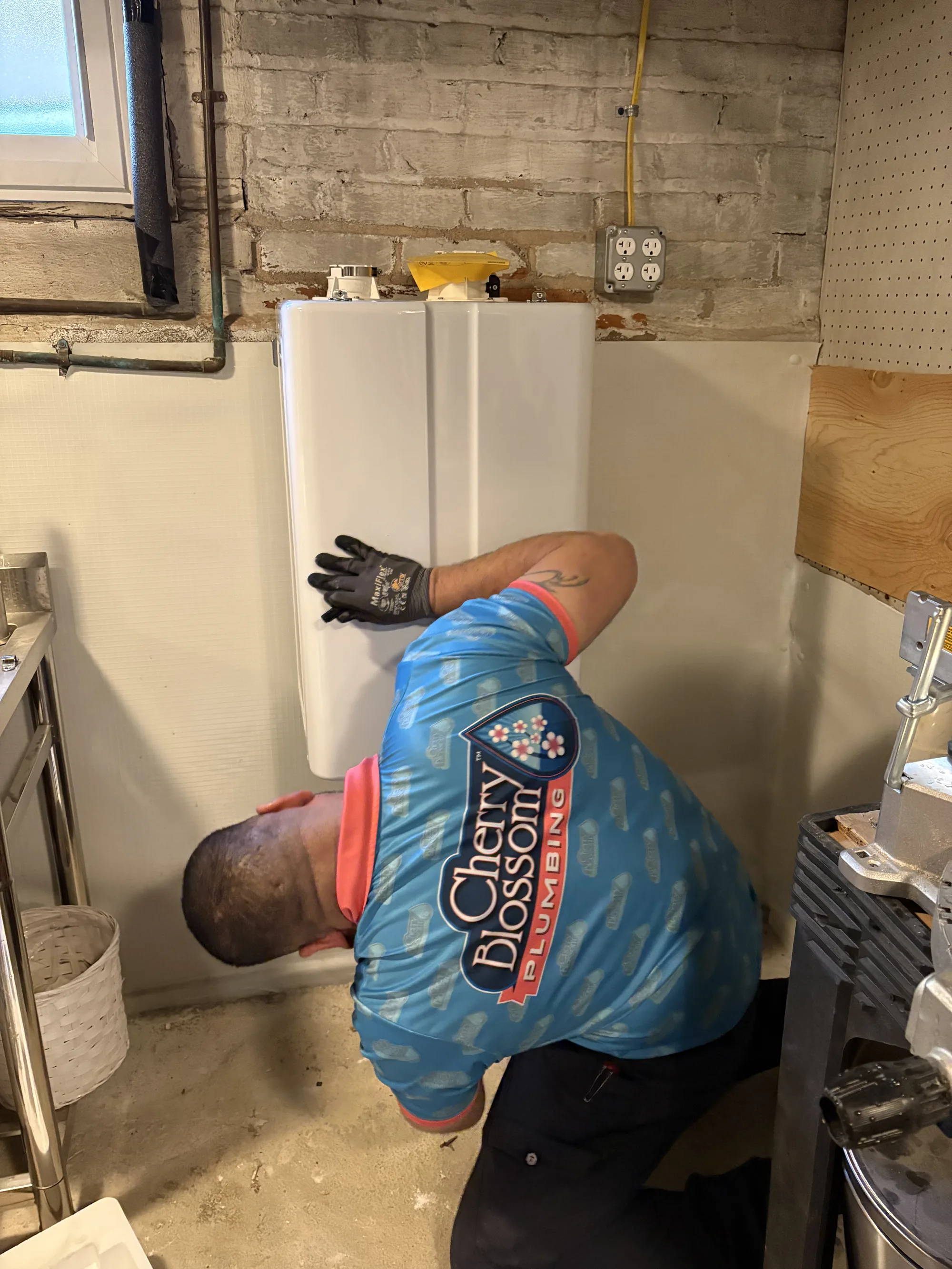 Technician Hanging Tankless