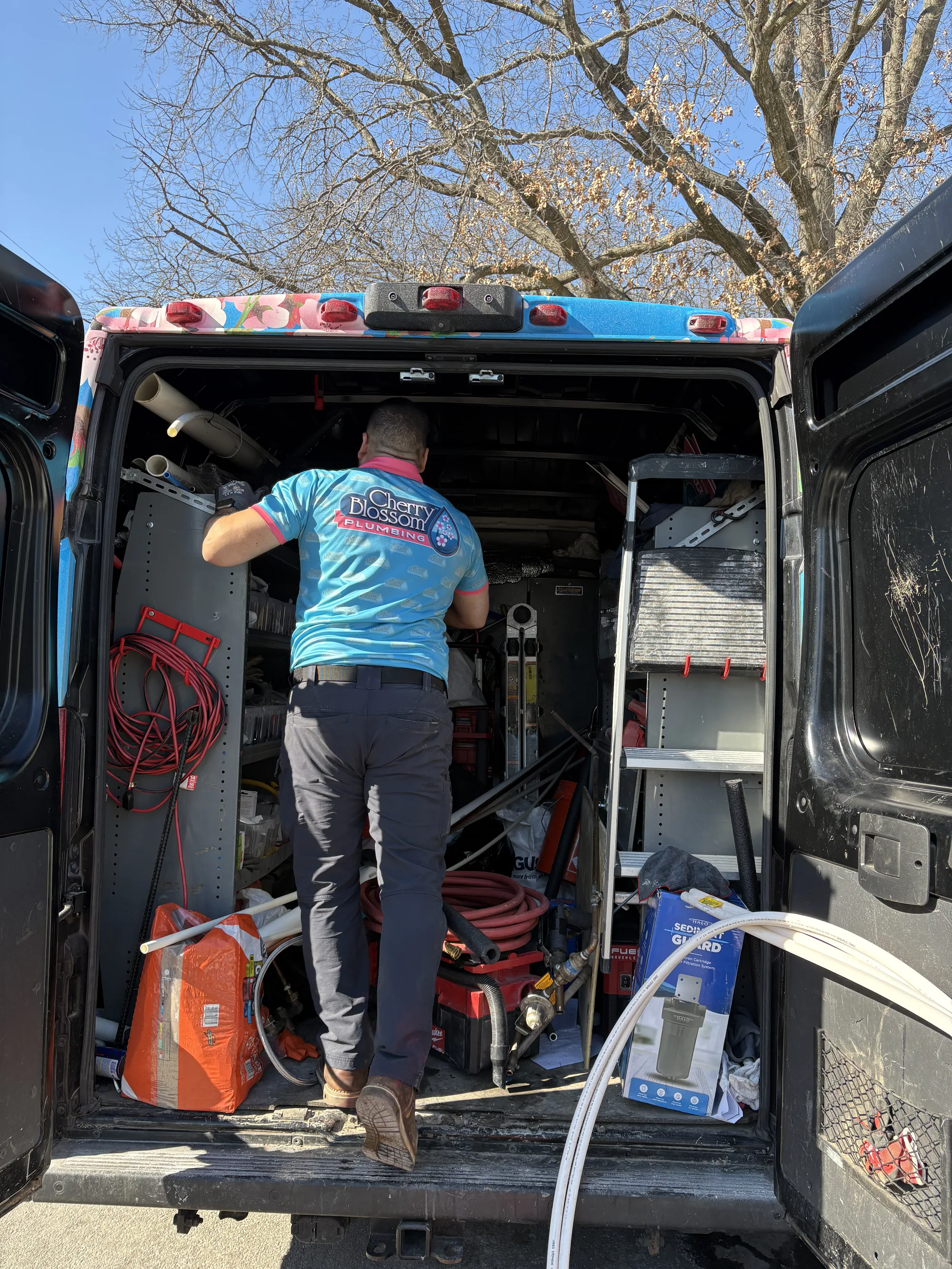 Technician ready for a call inside the service van