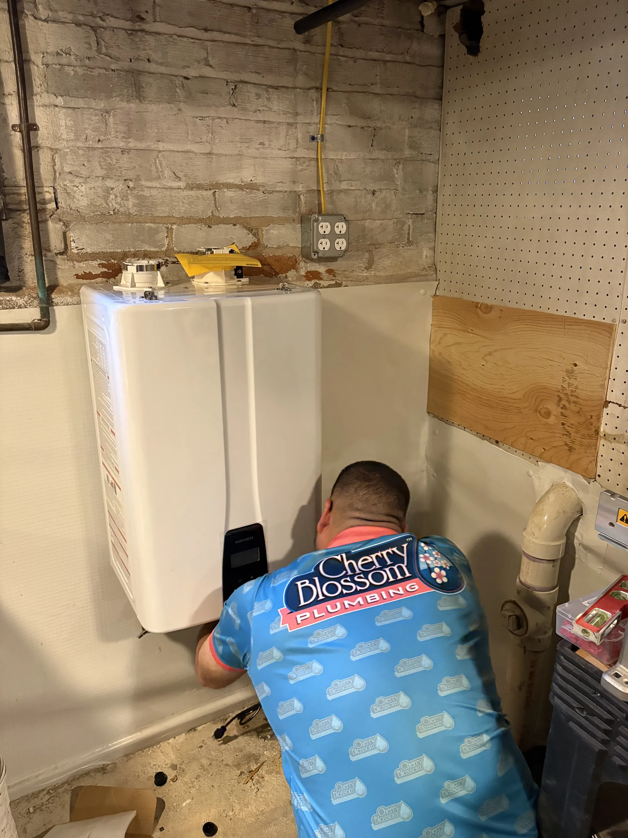 Technician Installing Tankless