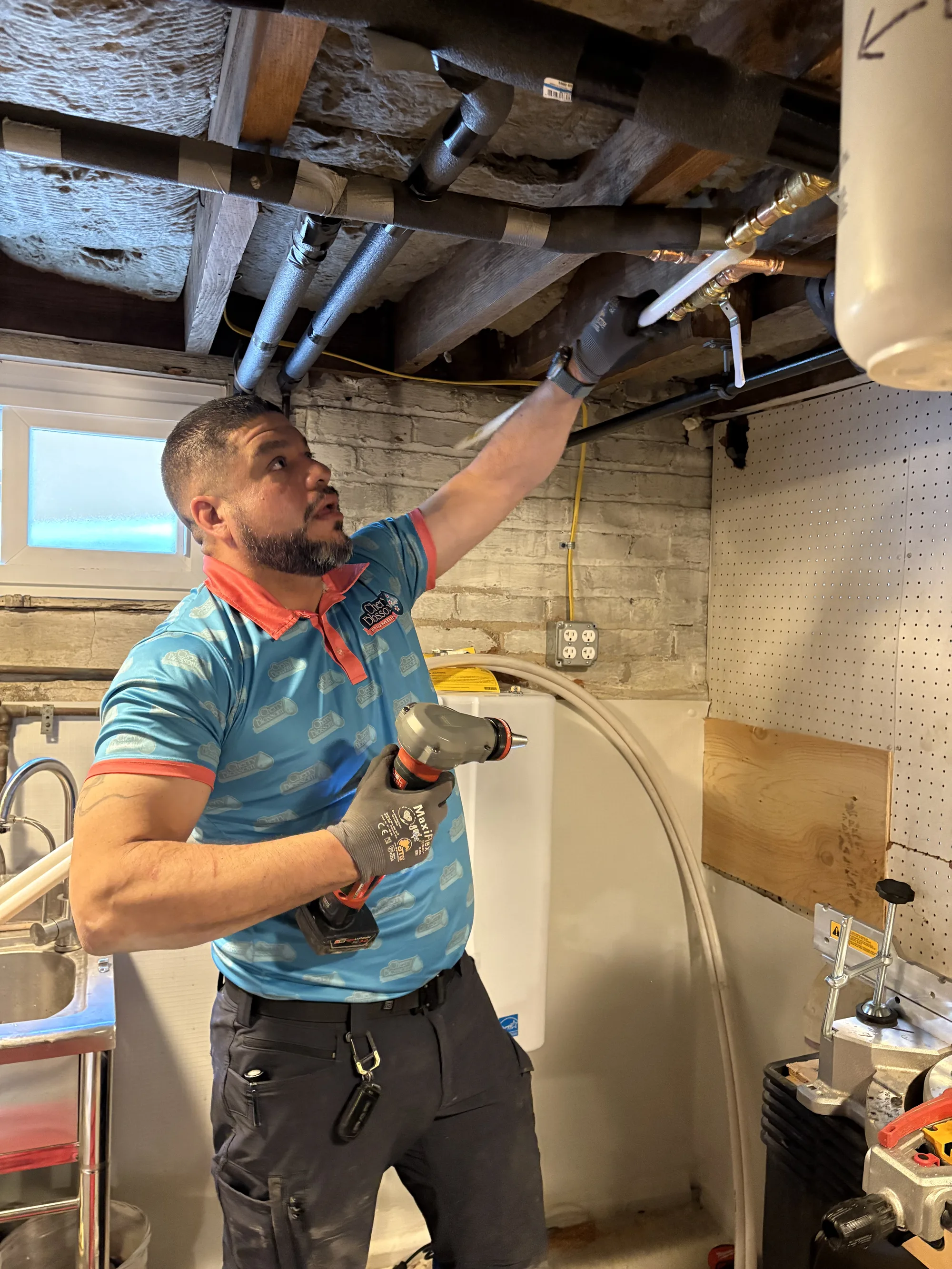 Technician Looking at Pipes