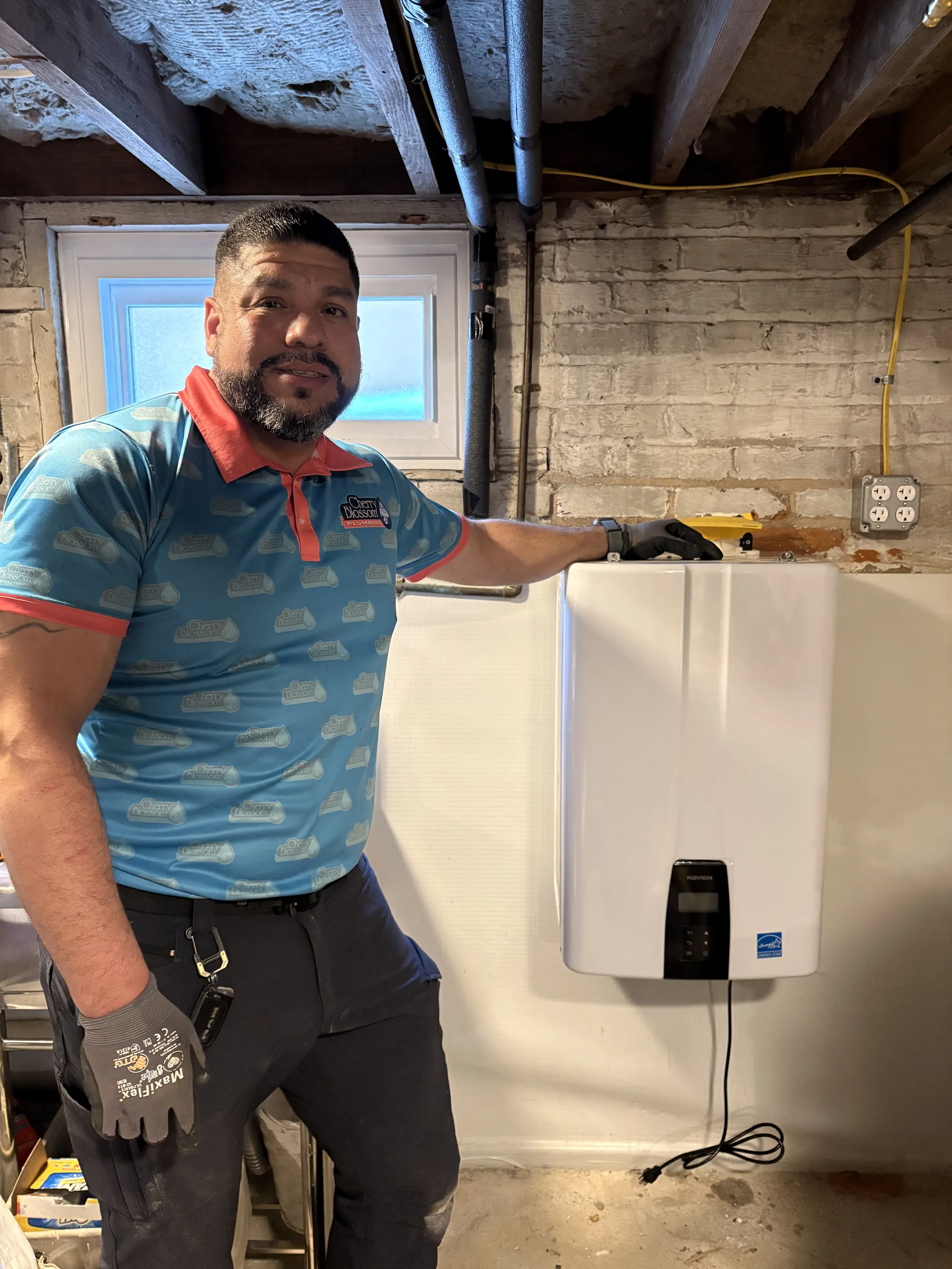 Technician with Tankless Water Heater (2)