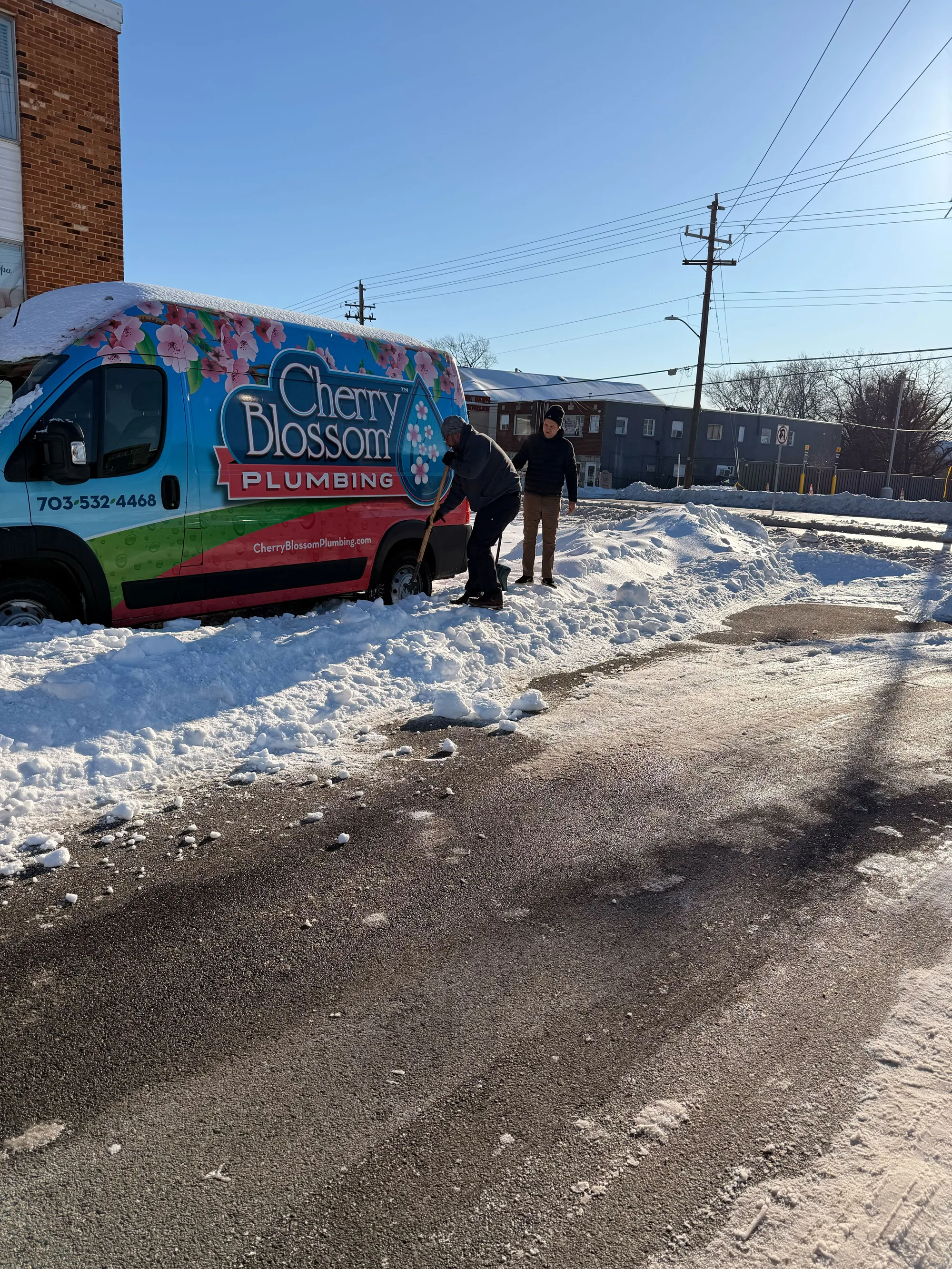Techs Shoveling Van out of Snow 4