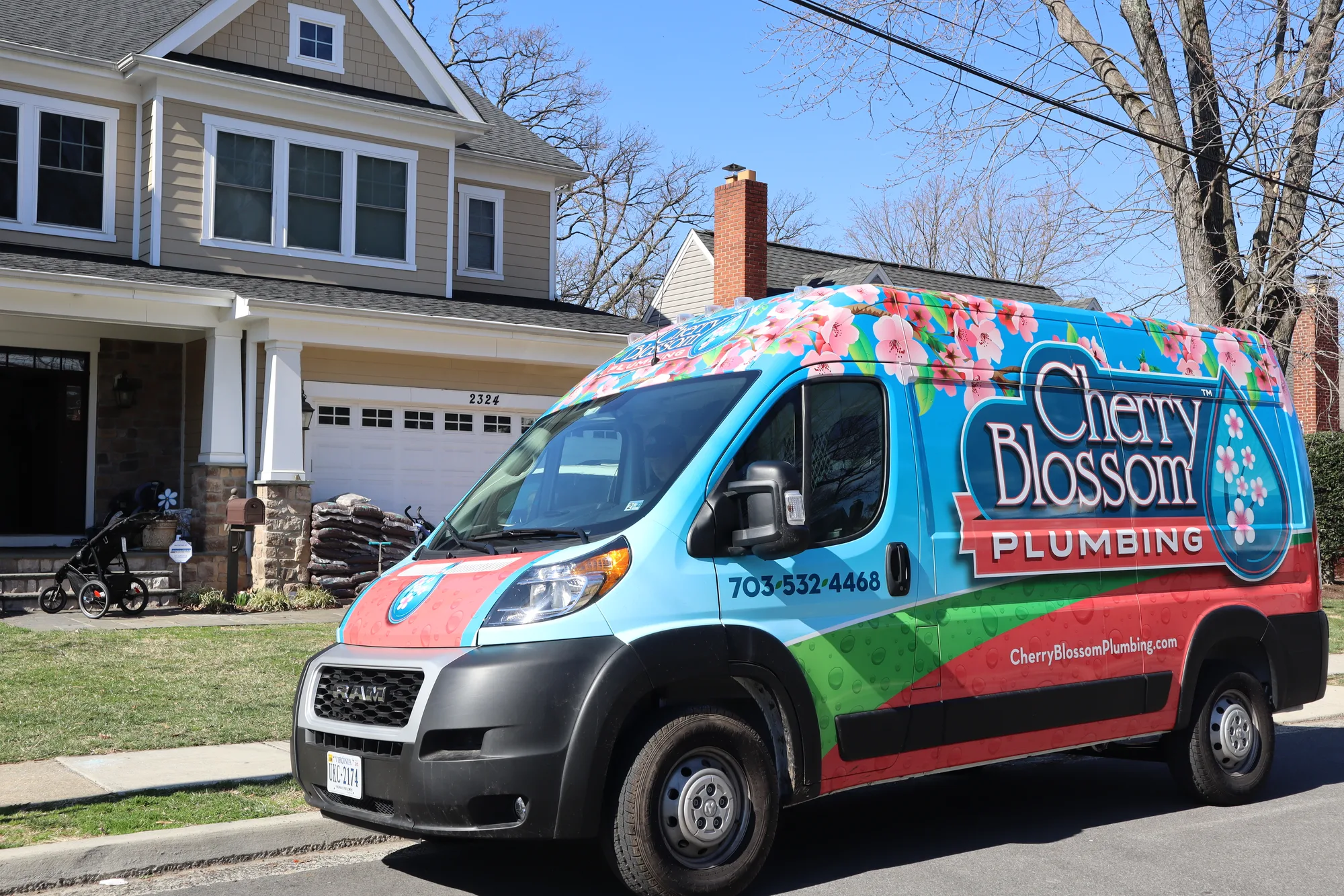 Branded service van in front of a home