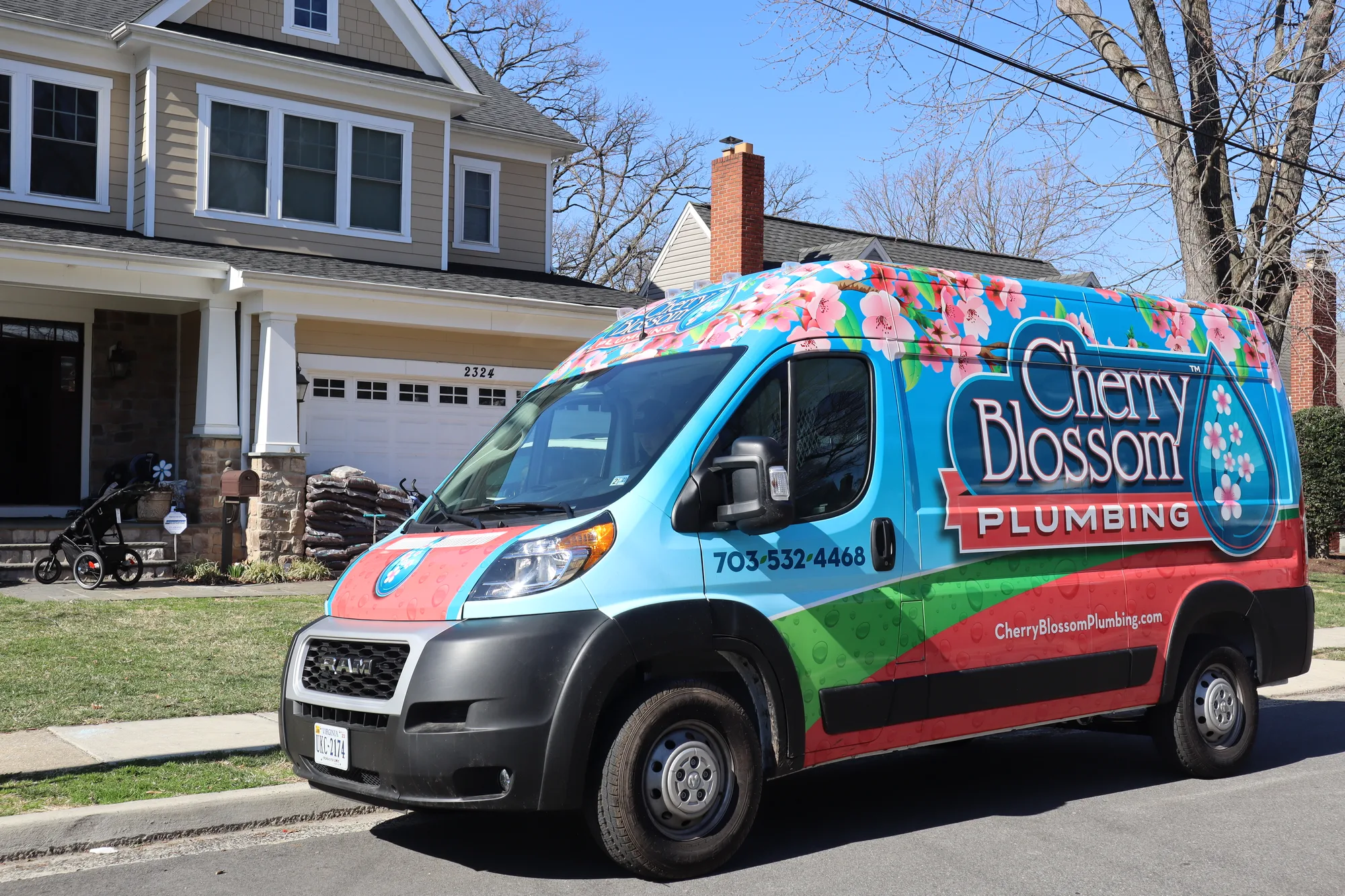 Branded service van parked in a residential driveway