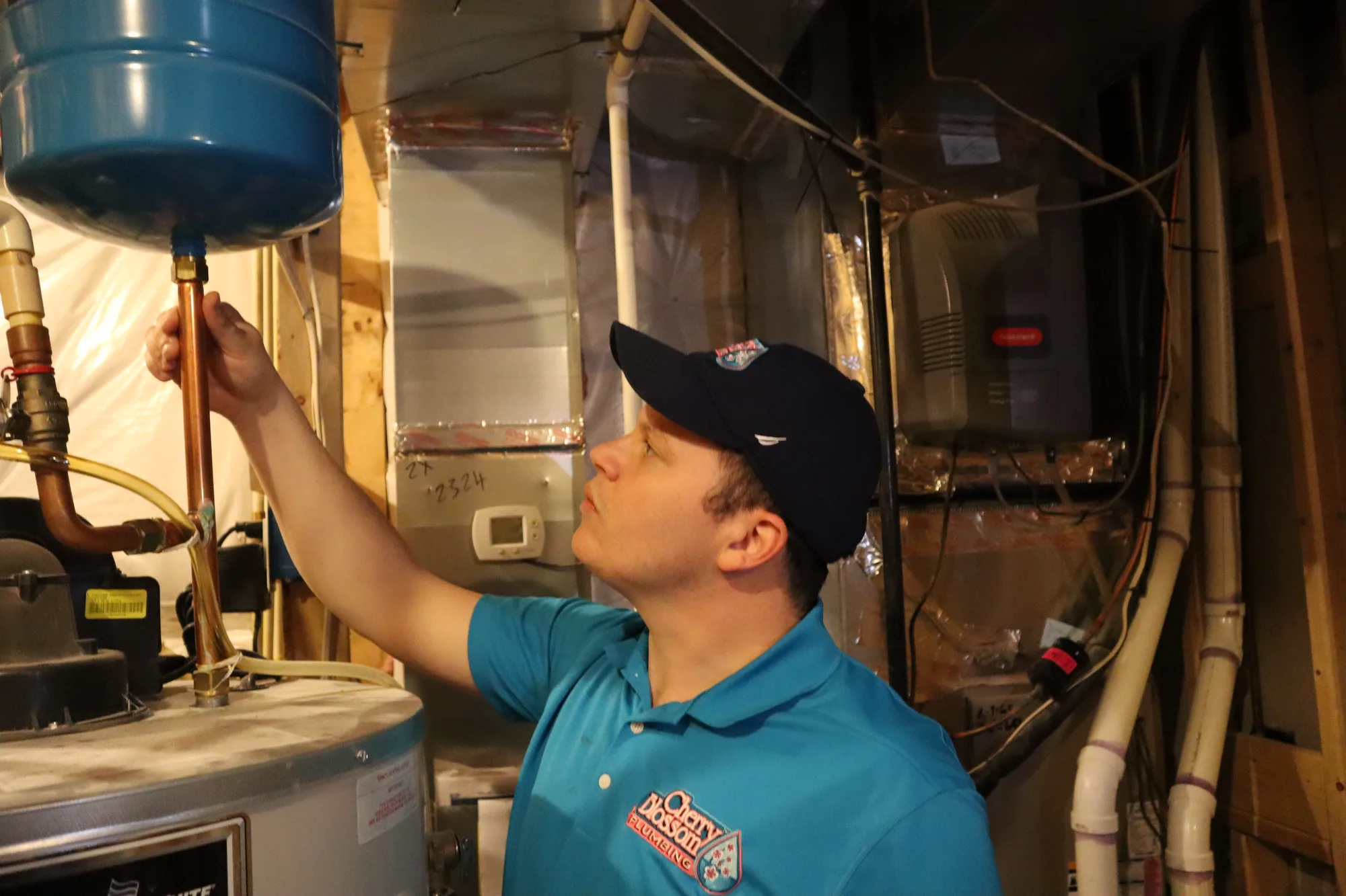 Water Heater - Technician Servicing Expansion Tank